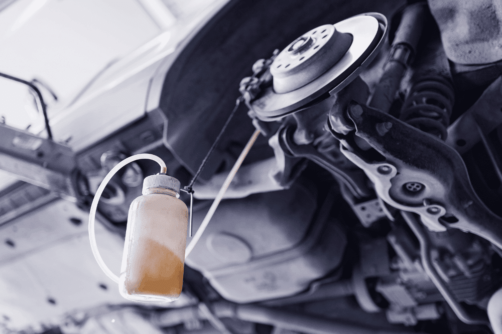 Brake fluid flush, auto repair in Morgan Hill, CA, at C&M Auto Service, Inc. Image of brake fluid being drained during a professional brake fluid flush to help maintain responsive braking performance, protect brake components, and support safe driving.